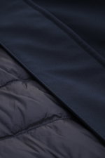 Close-up view of the dark blue Woolrich Softshell down jacket 'Barrow' showing elastic microfiber softshell, smooth water-repellent fabric, quilted lining, and fine stitching details.
