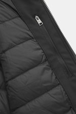 Close-up of the inner zipper pocket and quilted lining of the Woolrich Softshell down jacket 'Barrow' black, showing water-repellent elastic microfiber softshell with smooth feel, slim fit, and two-way zipper, photographed from above.