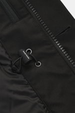 Close-up view of the Woolrich Down jacket 'Heavy GTX' black, showing high-quality microfiber fabric, robust two-way zipper, and adjustable drawcord for waist width. Features wind- and water-repellent, warm down filling, slim fit, wind flap with buttons, h