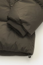 Emporio Armani Down jacket brown close-up of sleeve from above, showing high-quality microfiber, soft touch, warm down filling, slim fit, two-way zipper, wind flap with snap buttons, detachable hood, front pockets with snap button, logo patch made of leat