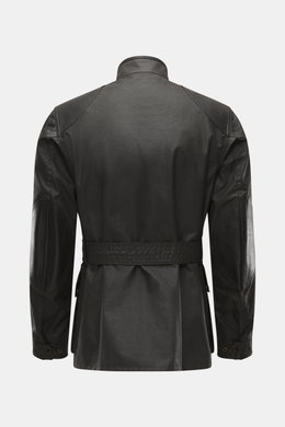 Belstaff Waxed jacket 'Trialmaster Phoenix' dark brown shown from the back, slim fit waxed cotton with leather details, waist belt, reinforced elbows, patch pockets, stand-up collar, and adjustable cuffs. Durable and timeless design from the limited 'Phoe