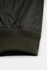 Close-up view of the sleeve cuff of the Belstaff Wax blouson 'Mount Jacket' dark olive, showing waxed cotton and ribbed knit cuff.

Description: <p>The robust blouson 'Mount Jacket' by BELSTAFF combines military aesthetics with British motorcycle traditio
