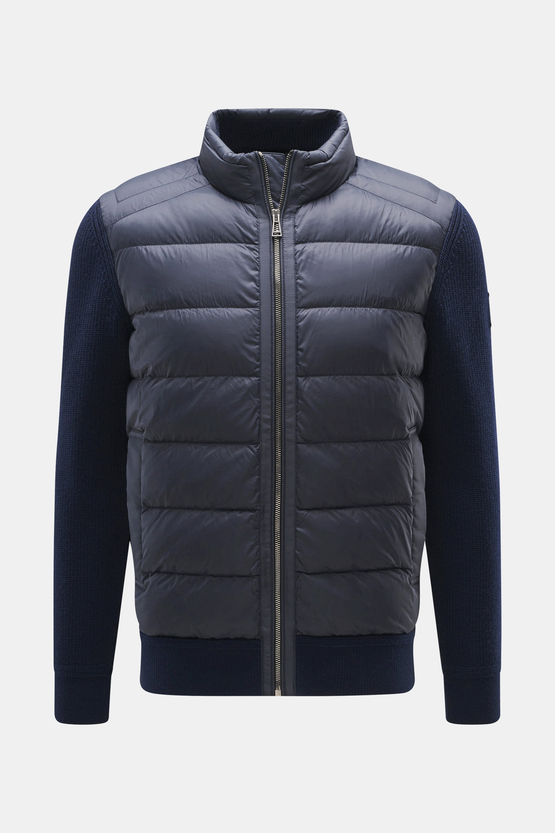 Front view of Belstaff Down knit jacket 'Compound' navy with quilted microfiber front, pure wool knit sleeves, stand-up collar, and zipper.

Description: <p>Soft patent knit made of pure wool, combined with a pleasantly light down quilted front – BELSTAFF