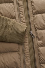 Close-up front view of Belstaff Down knit jacket 'Compound' khaki, showing patent wool knit cuff, quilted microfiber front with light down filling, robust zipper, and rib knit collar.

<p>Soft patent knit made of pure wool, combined with a pleasantly ligh