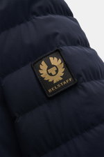 Close-up rear view of Belstaff Down jacket 'Chassis' navy showcasing high-quality microfibre fabric and the BELSTAFF woven label on sleeve.