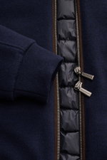 Close-up front view of the Moorer Down blouson 'Bellati' navy showing knitted wool-cashmere outside, lightweight down lining, two-way zip, elasticated cuff, and smooth lining. Features slim fit, slim standing collar, detachable shearling trim, zip front p
