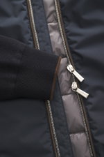 Close-up front view of Moorer Down Jacket 'Evan' navy, showing fine knit pattern rib-knit cuff from elastic cotton, smooth microfiber body, light down filling, two-way zipper with MOORER woven label, smooth lining fabric, and brown trim.