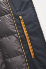 Close-up inside view of Moorer Down Jacket 'Evan' navy, showing smooth microfiber body, light down filling, two inner pockets with zippers, fine knit pattern, rib-knit collar, and yellow-accented zipper. Knit from elastic cotton, slim fit, detachable hood