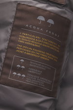 Close-up inside view of the Moorer Down Jacket 'Pagni' navy label showing waterproof microfiber fabric and quality details.