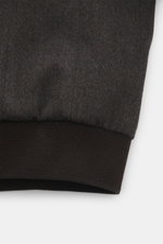 Close-up view of the cuff area of the Moorer Down blouson 'Donizetti' grey melange, showing the knit virgin wool-cashmere fabric and ribbed elastic cuff, highlighting craftsmanship and functional warmth. High performance at temperatures above freezing to 