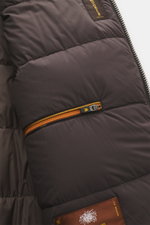 Close-up interior view of the Moorer Down blouson 'Donizetti' grey melange showing quilted lining, orange zipper, and brand labels, highlighting craftsmanship and warmth. High performance at temperatures from above freezing to below zero: The knitted down