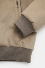 Close-up front view of the Moorer Cashmere down blouson 'Janos' beige showing ribbed cuffs, pure cashmere fabric, and MOORER label.  

<p>The Cashmere Down Blouson 'Janos' by MOORER perfectly combines functionality and timeless style. Made from high-quali