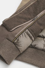 Moorer Cashmere down blouson 'Janos' beige close-up from above showing folded sleeve, ribbed cuff, zipper, velour leather trim, and ripstop lining. <p>The Cashmere Down Blouson 'Janos' by MOORER perfectly combines functionality and timeless style. Made fr