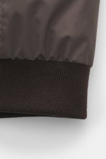 Close-up front view of the Moorer Down Blouson 'Billati' dark brown showing smooth high-quality microfiber fabric and elastic knitted hem cuff. Functional outerwear with timeless elegance from MOORER: Ready for the cold season, we present the lightweight 