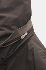 Close-up front view of the Moorer Down jacket 'Albini' anthracite, showcasing the high-quality microfiber fabric, water-repellent surface, and zipper detail of the short cut, luxurious jacket with detachable hood, warming down filling, slim fit, two-way z