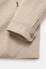 Close-up side view of the sleeve cuff of the Moorer Cashmere down jacket 'Teodor' beige, made of soft pure cashmere with a button, showcasing style and warmth.

<p>Style meets function: The down jacket from MOORER combines modern elegance with functional 