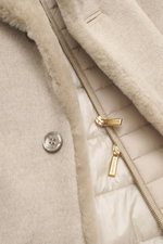 Close-up front view of the beige Moorer Cashmere down jacket 'Teodor' showing soft cashmere fabric, gold zippers, buttons, and inner quilted lining. Style meets function: The down jacket from MOORER combines modern elegance with functional warmth performa