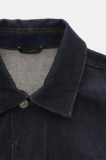 Stone Island Denim jacket 'Indigo Denim-Raw' navy close-up of raw denim collar and label from above, slim fit pure cotton.