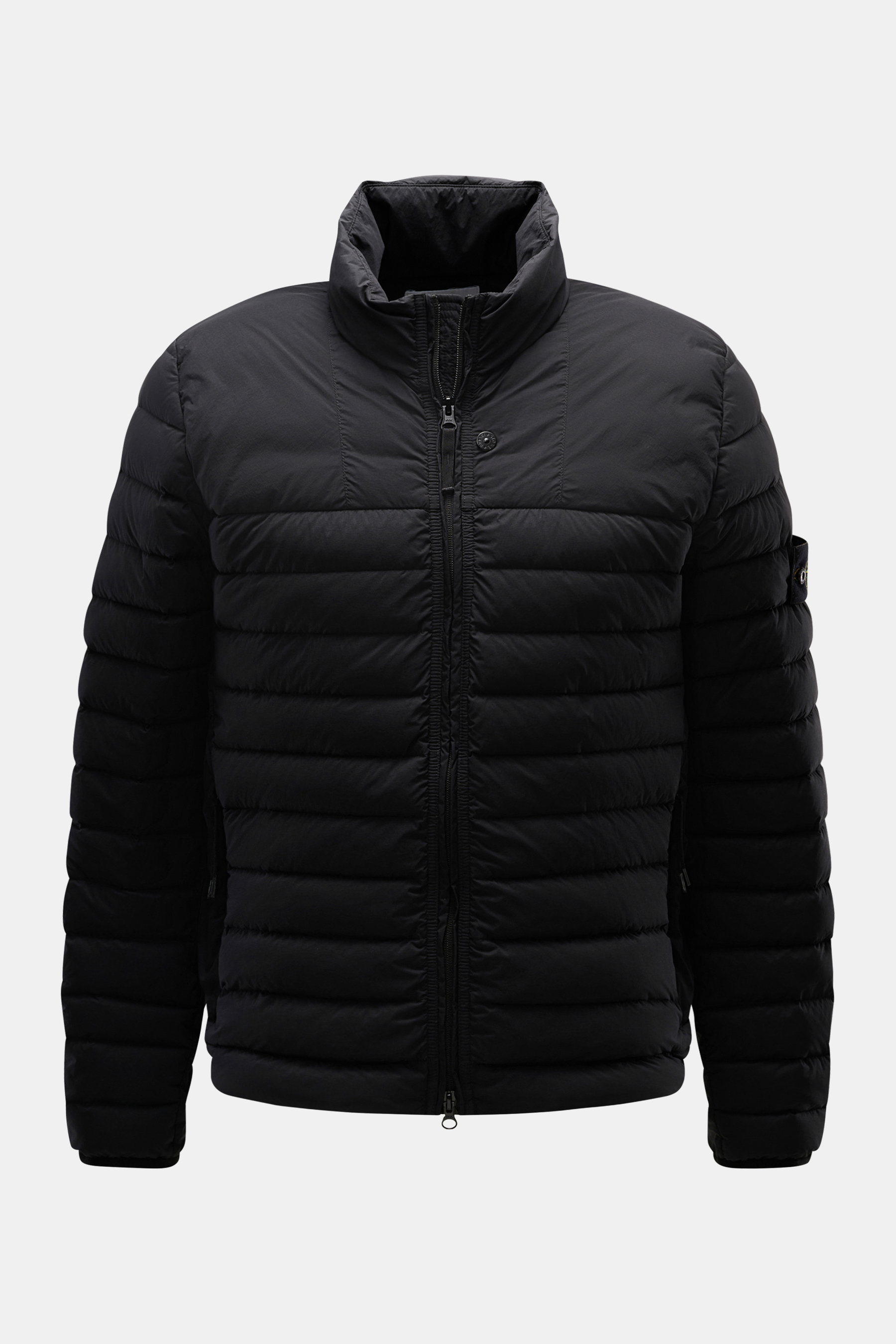 Front view of Stone Island Down Jacket 'Seamless Tunnel Nylon Down-TC' black, featuring high-quality microfiber, slim fit, light duck down filling, stand-up collar, high-closing two-way zipper, wind flap with snap button, hip pockets with zipper, elastic 