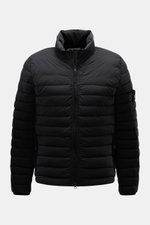 Front view of Stone Island Down Jacket 'Seamless Tunnel Nylon Down-TC' black, featuring high-quality microfiber, slim fit, light duck down filling, stand-up collar, high-closing two-way zipper, wind flap with snap button, hip pockets with zipper, elastic 