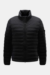 Front view of Stone Island Down Jacket 'Seamless Tunnel Nylon Down-TC' black, featuring high-quality microfiber, slim fit, light duck down filling, stand-up collar, high-closing two-way zipper, wind flap with snap button, hip pockets with zipper, elastic 