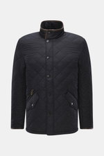 Front view of Barbour Quilted jacket 'Powell Quilt' navy in slim fit, featuring high-quality microfiber, light padding, fleece lining, two-way zipper, wind flap with snap buttons, stand-up collar with corduroy trim, front flap pockets, welt zipper pocket,