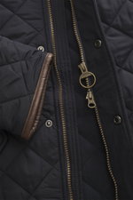 Close-up front view of Barbour Quilted jacket 'Powell Quilt' navy showing diamond quilted microfiber, two-way zipper with ring pull, snap buttons, fleece lining, and faux leather-trimmed cuffs.

Description: <p>Styled after the popular Chelsea design, the