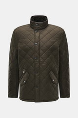 Front view of Barbour Quilted jacket 'Powell Quilt' dark olive, slim fit with light padding, fleece lining, stand-up collar, and multiple pockets.

Detailed description: <p>Styled after the popular Chelsea design, the 'Powell Quilt' quilted jacket feature