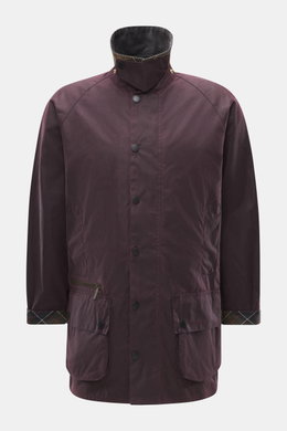 Front view of Barbour Wax jacket 'Beaufort Icons' purple, a classic British outdoor waxed cotton jacket with corduroy collar, snap buttons, multiple pockets, and tartan lining. Durable, water-repellent, regular fit with raglan sleeves and robust two-way z