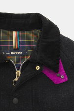 Close-up front view of the Barbour Paul Smith Loves Barbour Wool Jacket Transport showing pure wool fabric, corduroy turn-down collar, tartan lining, two-way zipper, and button details. Features include material-typical feel, Regular Fit, wind flap with s