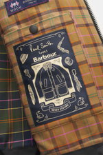 Close-up interior view of the Barbour Paul Smith Loves Barbour Wool Jacket Transport showing pure wool, material-typical feel, Regular Fit, two-way zipper, wind flap with snap buttons, corduroy turn-down collar, raglan sleeves, patch front pockets with fl