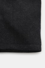 Close-up view of the black pure wool fabric texture of the Barbour Paul Smith Loves Barbour Wool Jacket Transport, showing material-typical feel, Regular Fit, two-way zipper, wind flap with snap buttons, corduroy turn-down collar, raglan sleeves, patch fr
