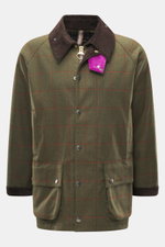 Front view of the Barbour Paul Smith Loves Barbour Beaufort Wool Jacket, pure wool with a green tartan pattern, brown corduroy collar, and colorful accents.

Description: <p>Cool collaboration from BARBOUR and PAUL SMITH: The 'Beaufort' wool jacket made o