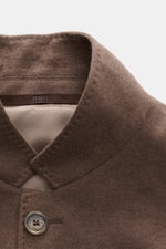 Fedeli Cashmere Jersey Jacket 'Damon' brown close-up from above showing soft cashmere jersey, variably wearable lapel, and branded button.