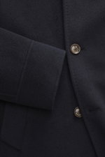 Close-up front view of the Montecore Cashmere Jacket navy showing soft pure cashmere fabric, double-breasted buttons, and cuff detail.