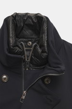 Close-up front view of the Montecore Down jacket dark navy showing the high-quality microfiber fabric, stand-up collar with light down filling, two-way zipper, and branded buttons, emphasizing its smooth feel, slim fit, water-repellent and breathable feat