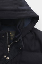 Close-up top front view of Mandelli Down jacket navy hood and zipper, made of virgin wool and cashmere with leather trim.

Description: <p>Luxurious wearing comfort for the cold season: The down jacket by MANDELLI made of virgin wool and cashmere reinterp