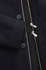 Close-up front view of the Mandelli Cashmere Down Jacket navy showing soft cashmere jersey, silver two-way zipper, black Mandelli buttons, and seam details, highlighting its pure luxury with light down filling, slim fit, stand-up collar with fur trim, det