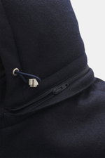 Close-up front-side view of the Mandelli Cashmere Down Jacket navy showing its soft cashmere jersey fabric, zipper, and drawstring detail. Pure luxury for the cold season: This jersey jacket made of cashmere by MANDELLI has a light down filling, which gua