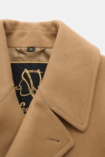 Close-up front angle of Sealup Pea coat 'Amalfi' camel showing soft wool and cashmere fabric, wide lapel, and elegant stitching.