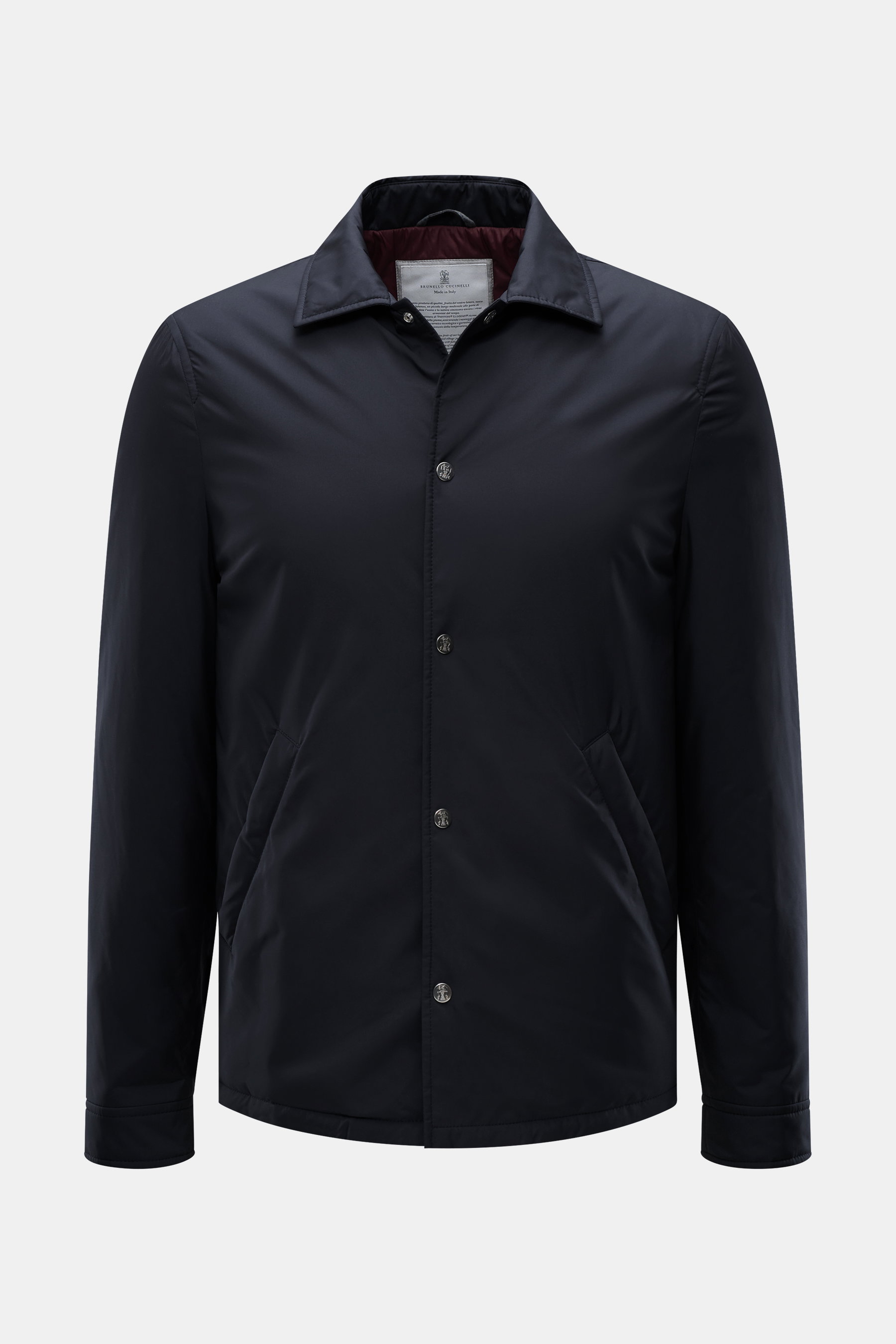 Front view of Brunello Cucinelli Jacket navy with slim fit, high-quality microfiber, soft smooth feel, wind- and water-repellent, light padding, snap button placket, turn-down collar, slanted hip pockets with snap button, smooth lining fabric, and three i