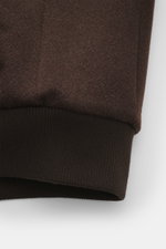 Close-up front view of the brown Rifugio Blouson 'Favola' showing wool-cashmere mix fabric and ribbed blouson cuff with soft touch.