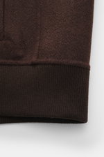 Close-up front view of the Rifugio Blouson 'Favola' dark brown, showing soft wool-cashmere blend fabric and ribbed cuff. 

<p>RIFUGIO combines Italian style with the highest wearing comfort in this soft jacket with a blouson cut made of smooth wool-cashme