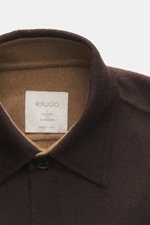 Close-up front view of the Rifugio Overshirt brown showing the turn-down collar, seven-button placket, and soft touch fabric, made of a mix of virgin wool and cashmere, slim fit with patch chest pockets with flap, sleeve cuffs with cuff, and unconstructed