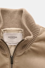 Close-up front view of Agnona Cashmere Blouson taupe showing rib knit blouson collar, two-way zipper, and soft suede details.