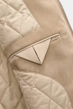 Close-up interior view of Agnona Cashmere Blouson taupe showing smooth lining fabric, two inside pockets, and fine suede details, highlighting craftsmanship.
