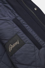 Close-up shot of the Brioni Cashmere jacket navy interior showing quilted lining with brand label, lamb leather details, and zipper.

Description: A luxurious everyday companion you won't want to take off: This jacket from BRIONI reinterprets the classic 