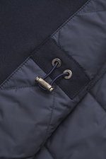 Close-up front view of the Brioni Cashmere jacket navy showing slightly elastic cashmere, lamb leather details, drawstring with metal Brioni logo.