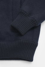 Close-up front view of the Lunaria Cashmere Cashmere Blouson navy showing ribbed elastic hem and sleeve cuff, pure cashmere, very soft touch, slim fit, two-way zipper, stand-up collar, slanted front pockets, and unlined design.