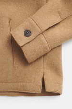 Close-up front view of the Lunaria Cashmere Cashmere jacket beige showing pure cashmere fabric, very soft touch, slim fit, five-button style, notched collar, slanted front pockets, and unlined design.